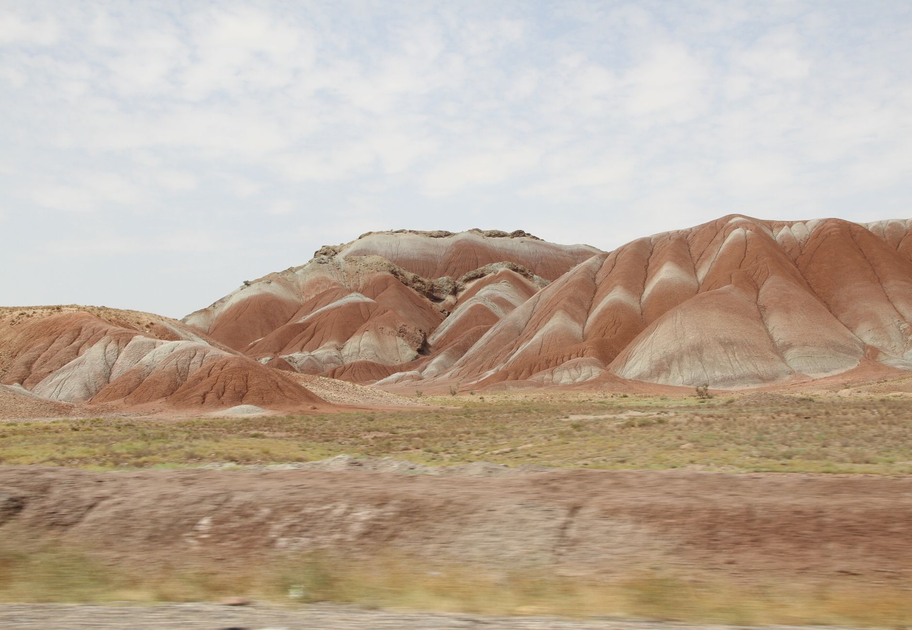 Scenic view of red and white hills in an arid desert landscape near Tabriz, Iran.