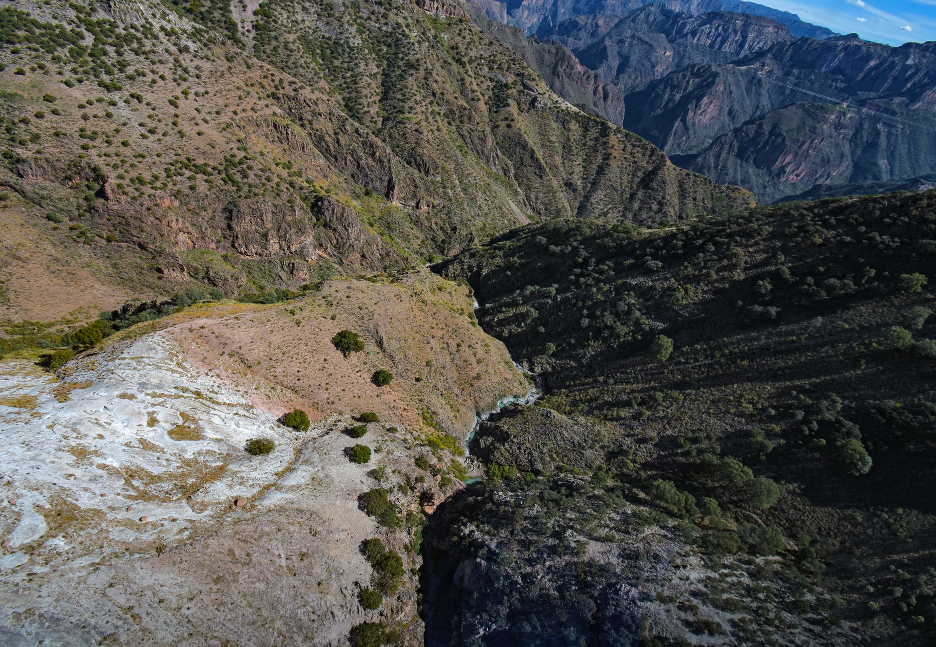 Stunning aerial landscape of Copper Canyon in Mexico showcasing rugged mountains and deep valleys.